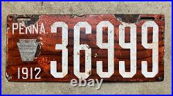 1912 Pennsylvania license plate 36999 porcelain red mahogany texture