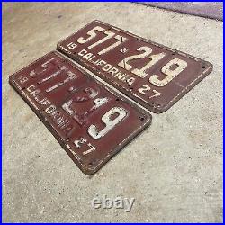 1927 California license plate pair 577 219 white on maroon embossed garage SBNC