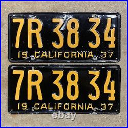 1937 California license plate pair 7R 38 34 yellow on black embossed garage SBNC