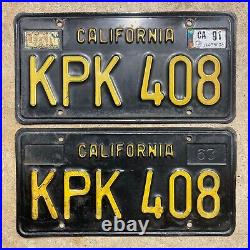 1963 California license plate pair KPK 408 yellow on black embossed 1964 garage