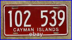 1990s Cayman Islands tourist bus license plate 102 539 white on red Caribbean