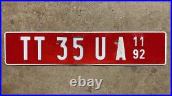 1992 Central African Republic license plate TT 35 UA white on red embossed