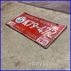 2015 Ngiwal Palau license plate K79-472 white on red embossed Micronesia