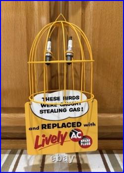 AC Spark Plug Bird Cage Caught Stealing Gas Station Oil Sign Vintage Style Decor