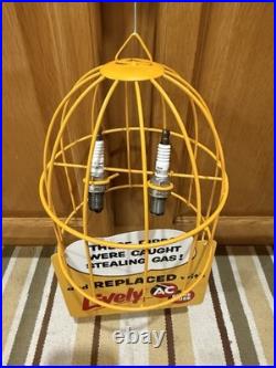 AC Spark Plug Bird Cage Caught Stealing Gas Station Oil Sign Vintage Style Decor