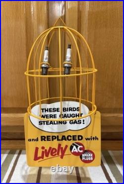 AC Spark Plug Bird Cage Caught Stealing Gas Station Oil Sign Vintage Style Decor