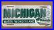 Michigan_Water_Wonderland_booster_license_plate_front_1950s_white_on_green_brass_01_wmvs