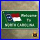North_Carolina_state_line_highway_marker_1960_road_sign_welcome_flag_36x18_01_ql