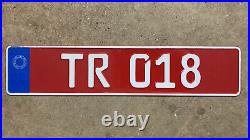 Turkish Republic of Northern Cyprus TRNC taxi license plate TR 018 white on red