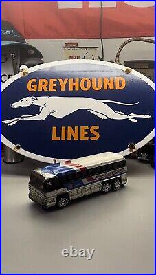 Vintage Greyhound Toy Bus And Metal Sign