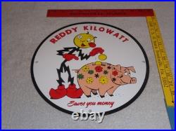 Vintage Reddy Kilowatt Piggy Bank Saves $$ 11 3/4 Porcelain Metal Gasoline Sign