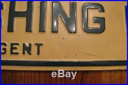 Vintage metal double-sided Wisconsin Fishing Licenses sign point of sale