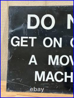 Vintage metal industrial sign Do not get on or off moving machine 18 x 24
