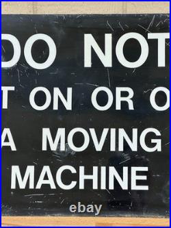 Vintage metal industrial sign Do not get on or off moving machine 18 x 24