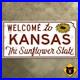Welcome_to_Kansas_Sunflower_State_line_highway_marker_road_sign_1961_24x12_01_ebr